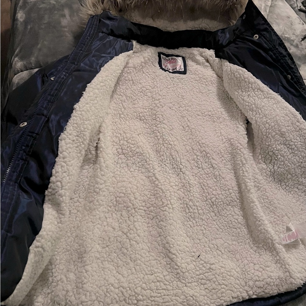 Girl 8/10 size puffer coat lined with cozy faux sherpa.